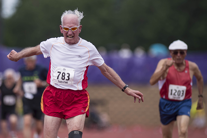 Melvin Larsen takes first place in the mens 100 meter race at the National Senior Games at the University of St. Thomas in St. Paul MN., on July 9, 2015 (© Rebekah A. Romero 2015)
